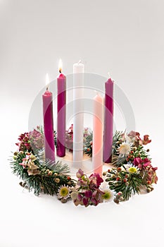 Traditional christian religious advent wreath with 5 candles, two candles burning