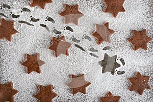 Traditional christmas background with gingerbread stars, dwarf stolen gingerbread, creative idea for christmas background