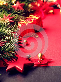 Traditional Christmas background in red with fir tree twigs