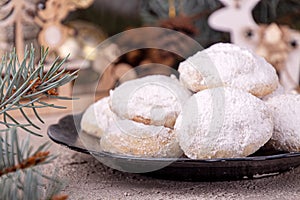 Traditional Christmas cookies biscuits snowballs covered icing sugar povder with almond nut, nutella chocolate an raspberry jam.