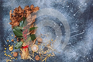 Traditional Christmas decoration in Serbia called Badnjak, Oak branch on rustic blue  surface