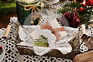 Traditional Christmas Eve wafer lying on hay in vintage style basket
