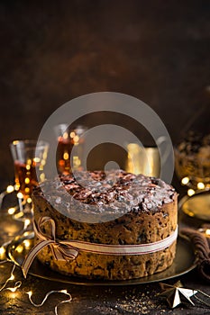 Traditional Christmas fruit cake on dark background