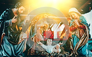 Traditional Christmas scenes and holy lights are used in the illustration of the birth of the baby.