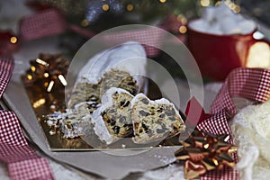 Traditional Christmas stollen, german as Christstollen is a yeast bread. Hot beverage with marshmallow. Cozy aesthetic