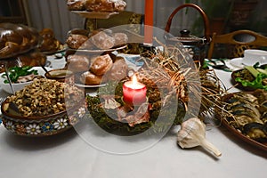 Traditional Christmas table in Ukraine, twelve meatless dishes: kutya, fried fish, mushroom picking, herring, pickled mushrooms, d