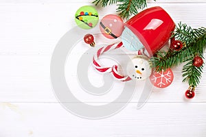 Traditional christmas themed french macaroons sweets in the form of snowman, snowflake, christmas tree and santa`s belly with can