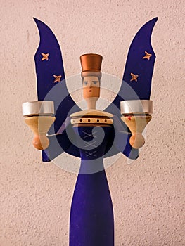 Traditional Christmas wooden figure - angel as a candlestick