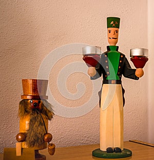 Traditional Christmas wooden figure - Christmas smoker and a miner`s figure as a candlestick