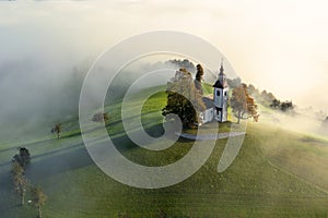 Traditional church between green hills