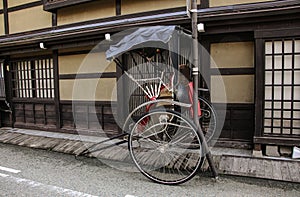 Traditional city scape of Takayama - carts for the travelers walking at the old streets Takayama, Japan