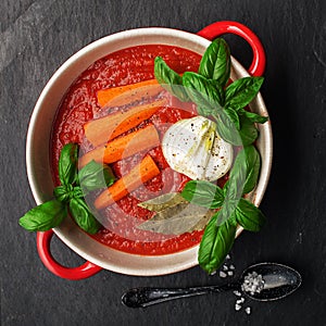 Traditional classic tomato sauce marinara for homemade food. Carrots, tomatoes, onions, basil, bay leaves, olive oil