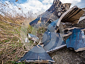 Traditional clay pot smashed and left on the grass