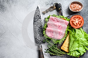 Traditional club sandwiches with turkey ham, cheese, tomatoes and lettuce. White background. Top view. Copy space