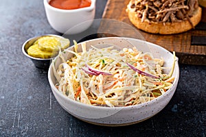 Traditional cole slaw salad, side dish for pulled pork sandwich