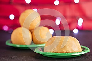 Traditional Colombian bunuelos Deep Fried Cheese Bread and natilla on christmas. Text space