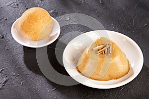 Traditional Colombian bunuelos Deep Fried Cheese Bread and natilla. Text space