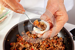 Traditional Colombian fried  stuffed yucca dumplings called carimaÃ±olas