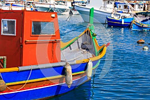 Traditional colorful boat luzzu at the port of Marsaxlokk, Malta. Closeup view