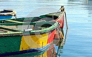 Traditional colorful boats luzzu at the port of Marsaxlokk, Malta. Copy space, closeup view