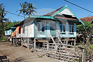 Traditional colorful family house on stilt