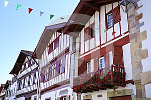 Traditional and colorful half-timbered houses in the old town of Ainhoa