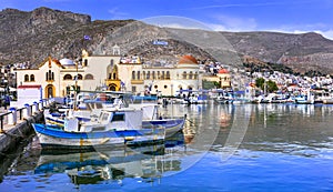 Traditional colorful houses,boats,sea and mountains,Kalymnos island,Dodecanese,Greece.