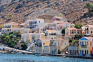 The traditional colorful houses and the port in Symi island Dodecanese, Greece.