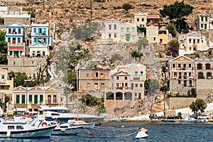 The traditional colorful houses and the port in Symi island Dodecanese, Greece.