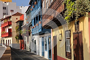 Traditional and colorful houses with wooden balconies located along Maritima avenue