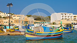 Traditional colorful Luzzu fishing boats at Marsaxlokk, Malta
