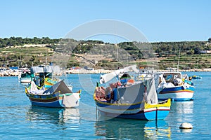 Traditional Maltese fishing boats - Luzzu photo