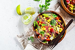 Traditional corn bean mexican salad in a wooden bowl. Mexican food concept