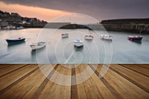 A traditional Cornish fishing village at sunrise in Cornwall England