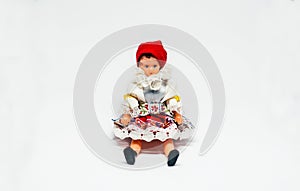 Traditional Costume Doll Sitting on white background