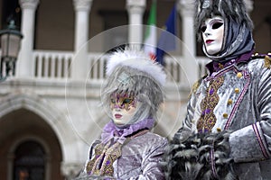 The traditional costumes of the carnival in Piazza San Marco photo