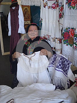 Traditional costumes stall at traditional ware fair at Romanian Peasant Museum in Bucharest, Romania on September 13, 2015