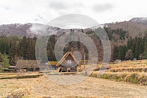 Traditional cottage houses in Shirakawago village with mountain hills in travel trip and holidays vacation in sunmer season, Gifu photo