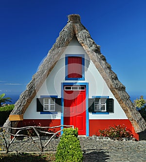 Traditional cottage in Santana (Madeira, Portugal) photo
