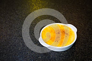 Traditional Creme Brulee, French dessert made with eggs, fresh cream, milk and sugar, slowly cooked in a water bath, with a crispy