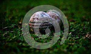 Traditional cricket balls in a ground unique photo