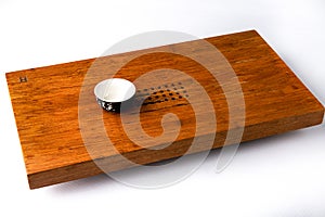 A traditional cup for oriental tea drinking on a wooden table for tea ceremonies. Space for copy