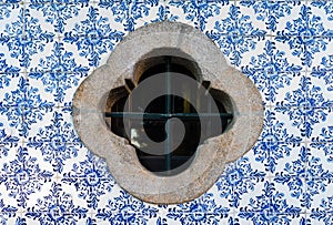 Traditional decoration of the facade of the house in Porto. Typical portuguese and spanish ceramic tiles Azulejos