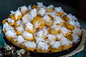 Traditional desserts, Khanom Hun Tra or Han tra, bean coated with egg serving on a wooden background photo