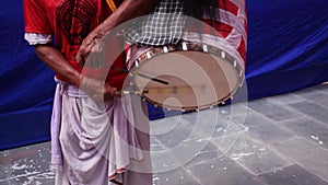 Traditional Dhak or drummer player playing dhak