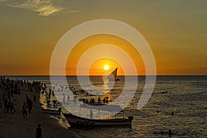 A traditional dhow in the background of a golden sunset, Stone T