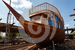 Traditional dhow under construction in wharf in Sur, Oman