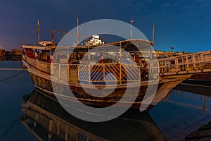 Traditional dhows mooring in Doha in Qatar during night