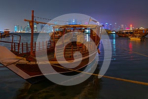 Traditional dhows mooring in Doha in Qatar during night