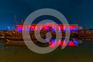 Traditional dhows mooring in Doha in Qatar during night